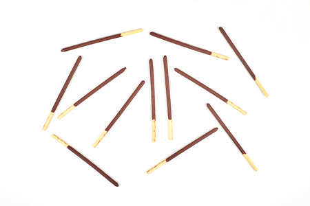 Biscuit sticks in chocolate coating on white background. Chocolate, cookies, biscuits coated bar.