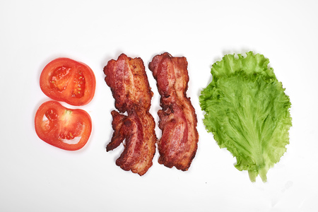 Ingredients for making sandwich. fresh vegetables, tomatoes, bread, becon, cheese. Isolated on white background, top view, copy spaceの写真素材
