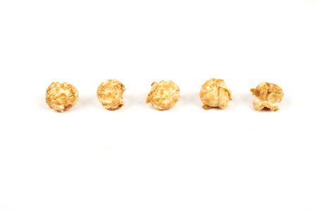 caramel popcorn on white background.の写真素材