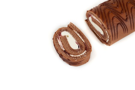 Chocolate biscuit roll cake isolated on white background.の写真素材