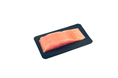 fillet of red fish in vacuum packing. Isolated on whiteの写真素材