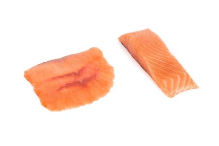 sliced red fish with lemon on white backgroundの写真素材