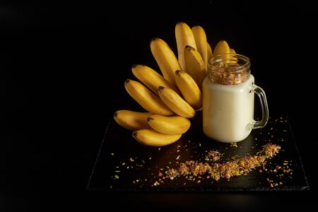 Banana smoothie with almond milk in glass cup. , Vegan food Conceptの写真素材