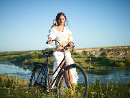 woman with an old bicycleの写真素材