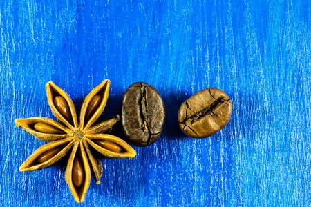 Star anise with coffee beans on wooden backgroundの写真素材