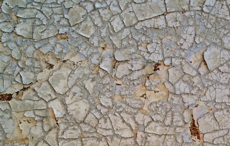 Old white paint on a wooden surface, weathered and flaking - textureの写真素材