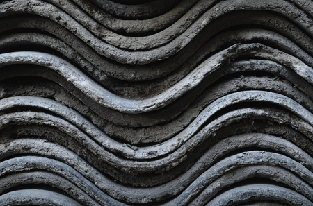 A side view on the slate sheets stacked on each other closeupの写真素材