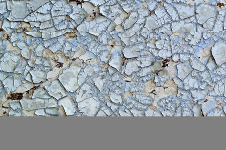 Texture - old paint of blue color on a wooden surface, weathered and flakingの写真素材