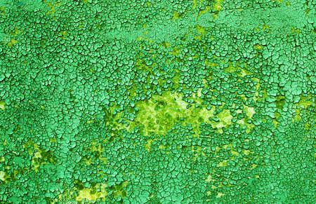 Old green paint on a wooden surface, severely chappedの写真素材
