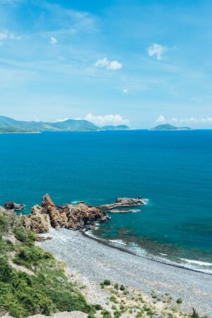 Tropical seascape with turquoise sea, white clouds in the sky, beautiful view of mountains, Asia, Vietnamの写真素材