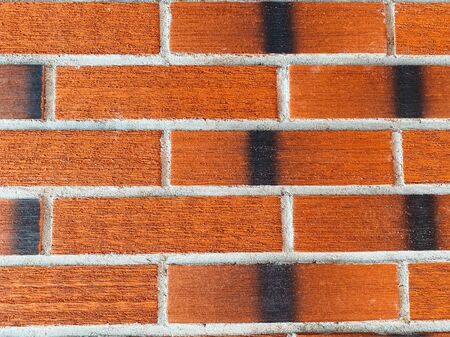 Red brick wall with textured brick. Contrast stitches. Durable masonry. brick background. Smooth...