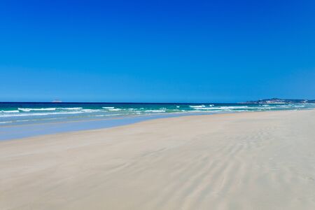 ropical exotic beach for a beautiful backdrop or screensaver, with azure water in the sea and clear blue sky. concept of summer vacation. Copy placeの写真素材