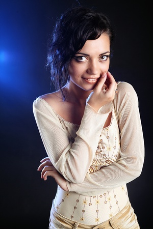 Studio shot of young beautiful woman on dark background  Professional make up and hair styleの写真素材