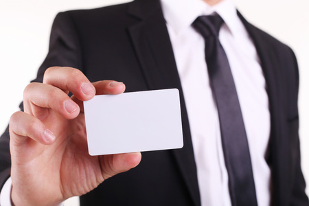Businessman showing his business card. You can just add your text there.の写真素材