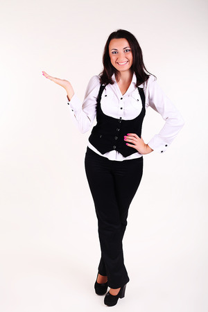 Showing businesswoman, isolated on whiteの写真素材