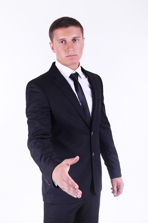 Young business man ready to set a deal over white backgroundの写真素材
