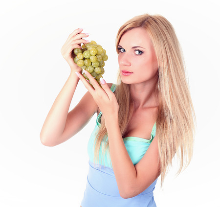 Girl with a bunch of grapes, happy face, healthy lifestyleの写真素材