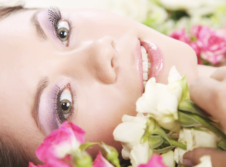 Very beautiful girl lying in floschersの写真素材