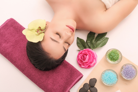 Woman under professional facial massage in beauty spa.の写真素材