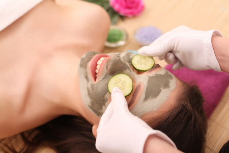 Spa. Care Facial. Face Treatment. Woman in Beauty Salon Gets Marine Maskの写真素材