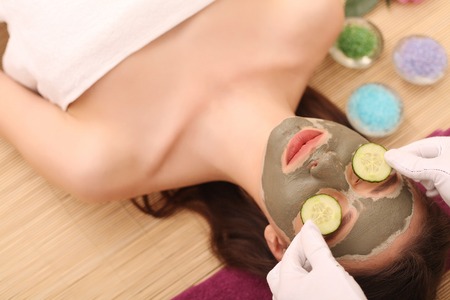 Spa. Care Facial. Face Treatment. Woman in Beauty Salon Gets Marine Maskの写真素材