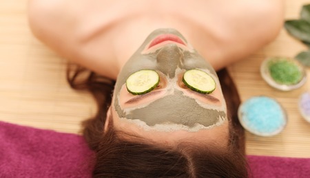 Spa. Care Facial. Woman taking care of her face in spa treatments.の写真素材