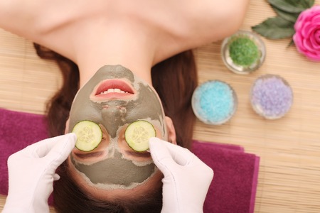 Spa. Care Facial. Woman taking care of her face in spa treatments.の写真素材