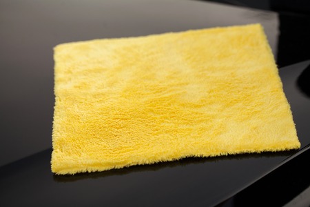 Cleaning car. Microfiber for cleaning and polishing the carの写真素材