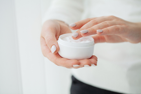 Scin care. Beautiful woman hands with creamの写真素材