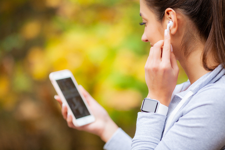 Woman Listening Music, Doing Workout Exercises On Streetの写真素材