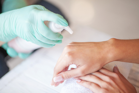 Woman Hand Care. Applying Peeling Scrub or Moisturizing Cream on to the Handsの写真素材