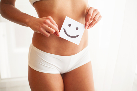Women Health. Beautiful Female Body In Panties With Smile Cardの写真素材