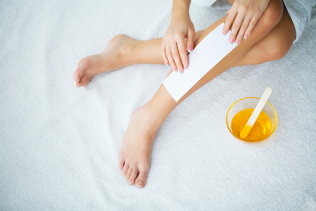 Sugaring: epilation with liquate sugar at legsの写真素材