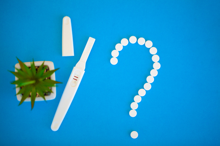 Pregnancy test. The result is positive with two strips. Treatment of infertility with pills, help in conceiving a child. Tablets from pregnancy do not work, contraception.の写真素材