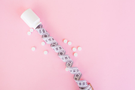 Medical Concept. Pills On Pink Background. Pharmacy Theme, Capsule Pills With Medicine Antibiotic in Packagesの写真素材