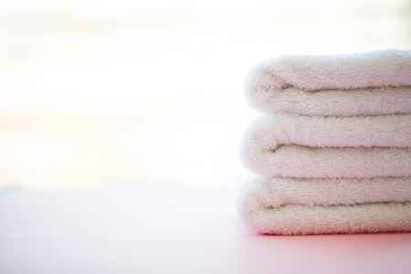Beautiful Spa Composition White Towels on Pink Tableの写真素材