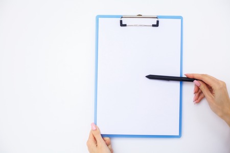 Blank Folder with White Paper. Hand that Holding Folder and Handle on White Background. Copyspace. Place for Textの写真素材