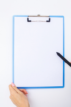 Blank Folder with White Paper. Hand that Holding Folder and Handle on White Background. Copyspace. Place for Textの写真素材