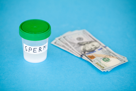 Health. Close up Concept of Bank Sperm. Infertility Bank with Sperm. Doctors Hand Holds Container...