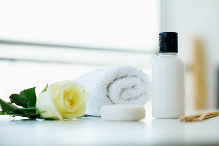 Spa still life with blossoms of white rose and essential oilsの写真素材