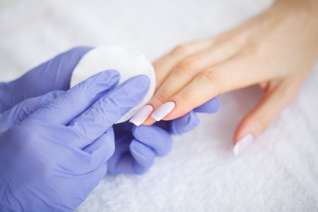 Hand and Nail Care. The Master Give Manicure Services for the Client. Beautiful Womens Hands with Perfect Manicure. Beauty Day Spa Manicureの写真素材