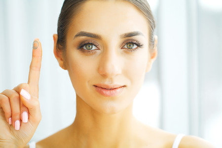 Vision Contact Lenses. Closeup With Beautiful Woman Faceの写真素材