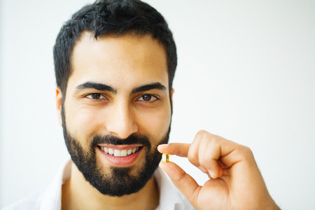 Beautiful Man Taking Pill, Medicine. Vitamins And Supplementsの写真素材