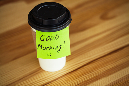 Good Morning. Coffee To Go. Coffee Cups With Cover and Coffee Beans on Wooden Table Backoundの写真素材