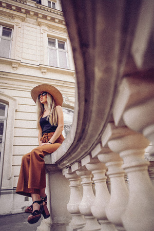 Noise. Vintage Style. Elegant woman travel on street of ukrainian cityの写真素材