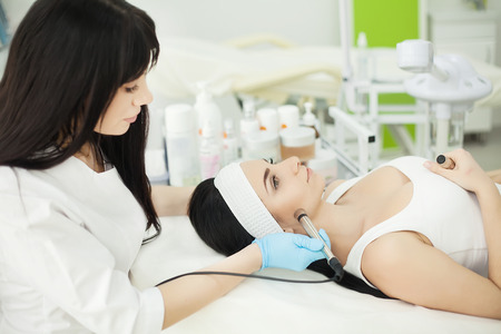 ultrasonic face cleaning, peeling, in a beauty salonの写真素材