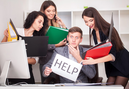 frustrated attractive businessman in her 20s holding help sign desparate suffering stress overworked...