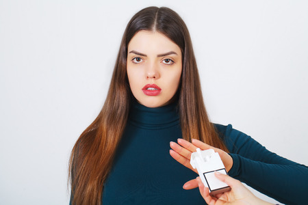 Woman with broken cigarette - stop smoking conceptの写真素材