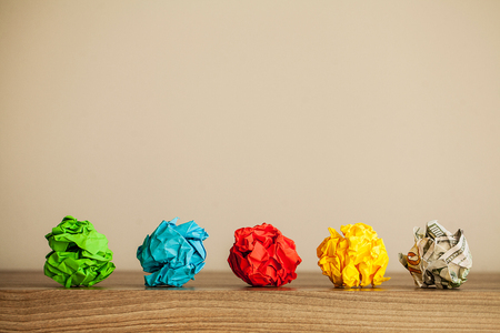 Great idea concept. Crumpled colorful paper on wooden table. Copy spaceの写真素材