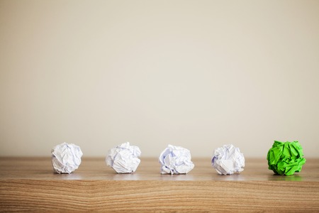 Great idea concept. Crumpled colorful paper on wooden table. Copy spaceの写真素材